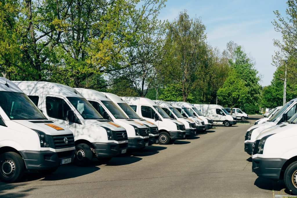 Stock Image: White Delivery Vans Lined up in a Car Park. 